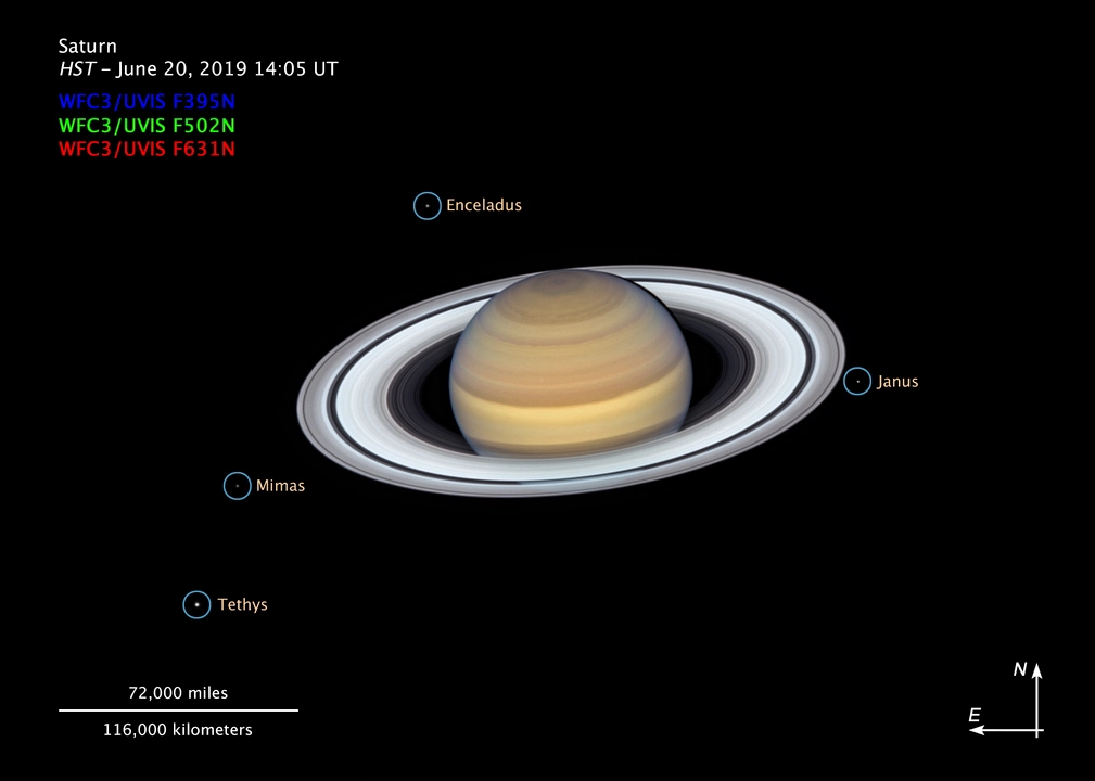 The latest image showing four of Saturn's moons The latest image showing four of Saturn's moons